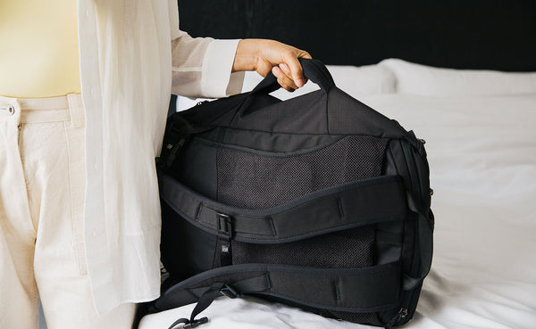 A person holding the grab handle of the Techonaut 30.
